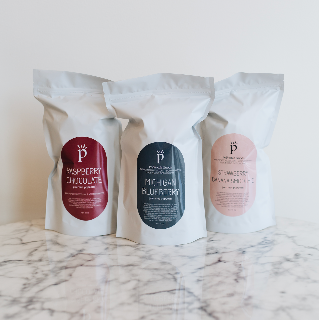The Fruit Creations Sampler Pack includes Raspberry Chocolate popcorn, Michigan Blueberry popcorn, and Strawberry Banana Smoothie popcorn. This sampler pack makes a great gift or eases decision making. Popnotch Goods is located in Grand Rapids Michigan on Wealthy Street. Grand Rapids Popcorn. 746 Wealthy Street SE Grand Rapids Michigan 49507.