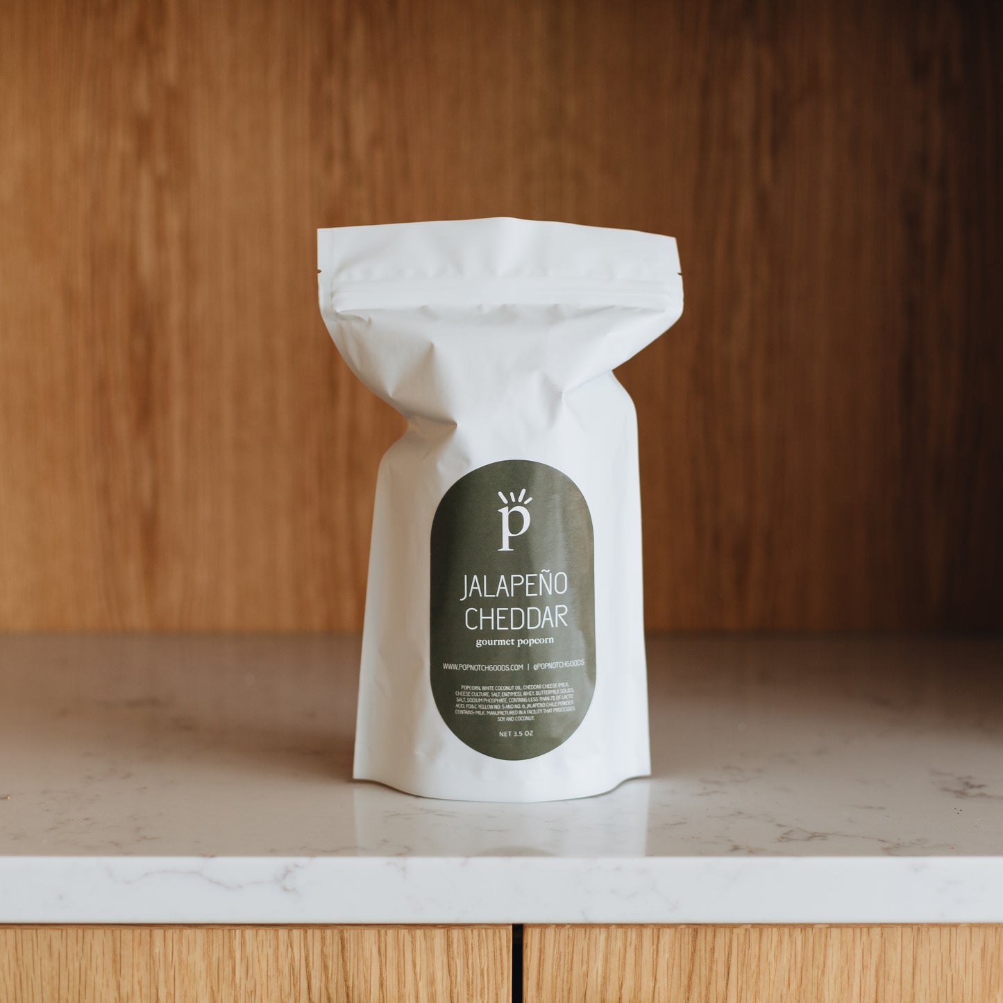 Spice it up with our Jalapeno Cheddar popcorn! This popcorn is the owners favorite and is hard to put down. With a creamy cheese and a backend kick of spice will leave you coming back for more. Order online now or stop in Popnotch Goods to enjoy this spicy treat! Featured is our Large Bag (3.5oz)