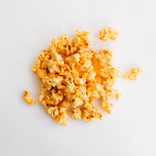 A true classic popcorn. Our Cheddar is creamy with a perfect crunchy popcorn. Get this wonderful tasting popcorn now. Order it online or stop in Popnotch Goods to get the best tasting cheddar popcorn.