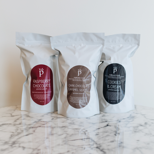 The Chocolate Lovers Sampler Pack includes Raspberry Chocolate popcorn, Dark Chocolate Sea Salt popcorn, and Cookies and Cream popcorn. This sampler pack makes a great gift or eases decision making. Popnotch Goods is located in Grand Rapids Michigan on Wealthy Street. Grand Rapids Popcorn.