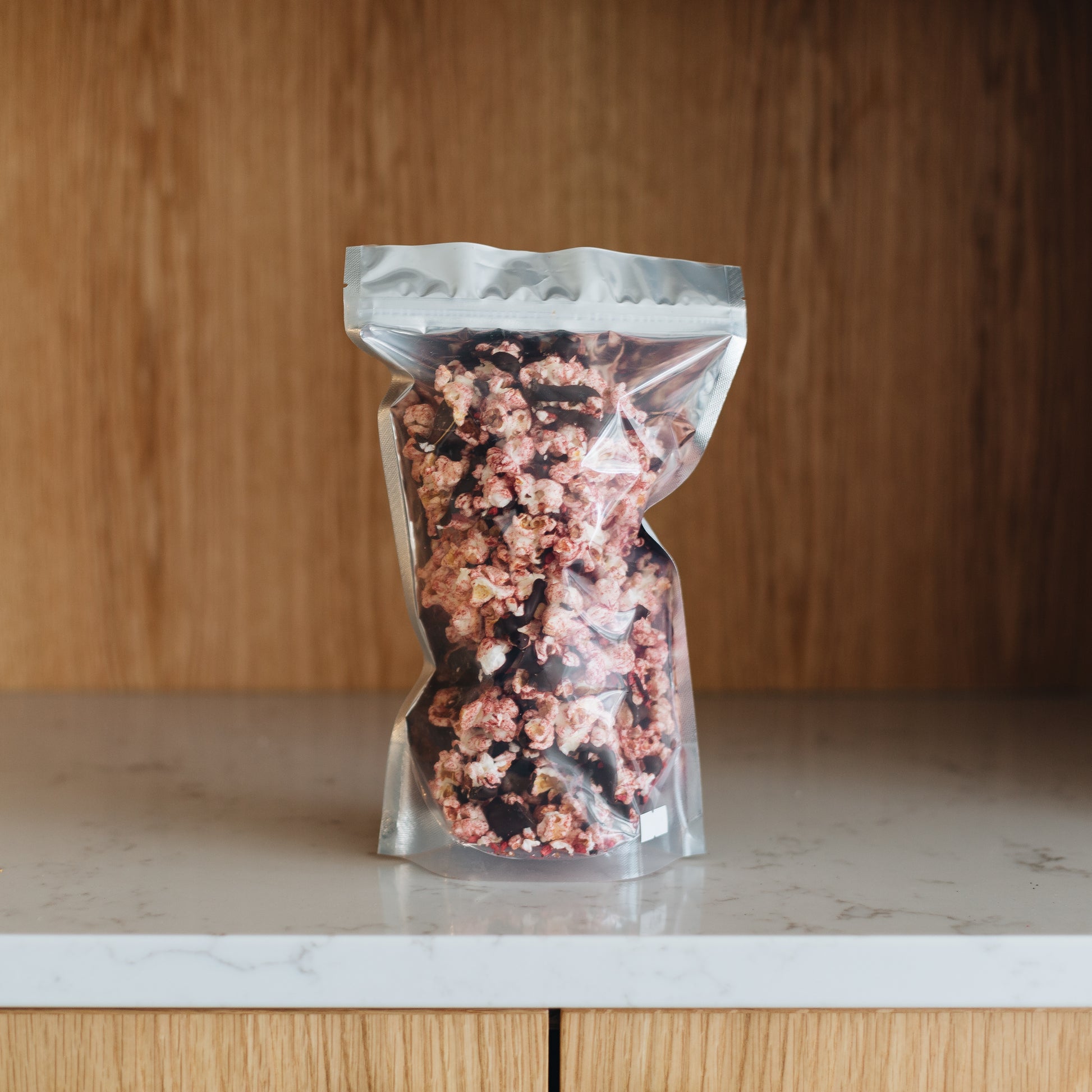 A truly gourmet popcorn. This raspberry chocolate popcorn is hand created with the freshest and highest quality ingredients to deliver an authentic Raspberry Chocolate popcorn. Order online now or stop in to get this delectable treat. Featured is our Large Bag of Raspberry Chocolate (4oz)