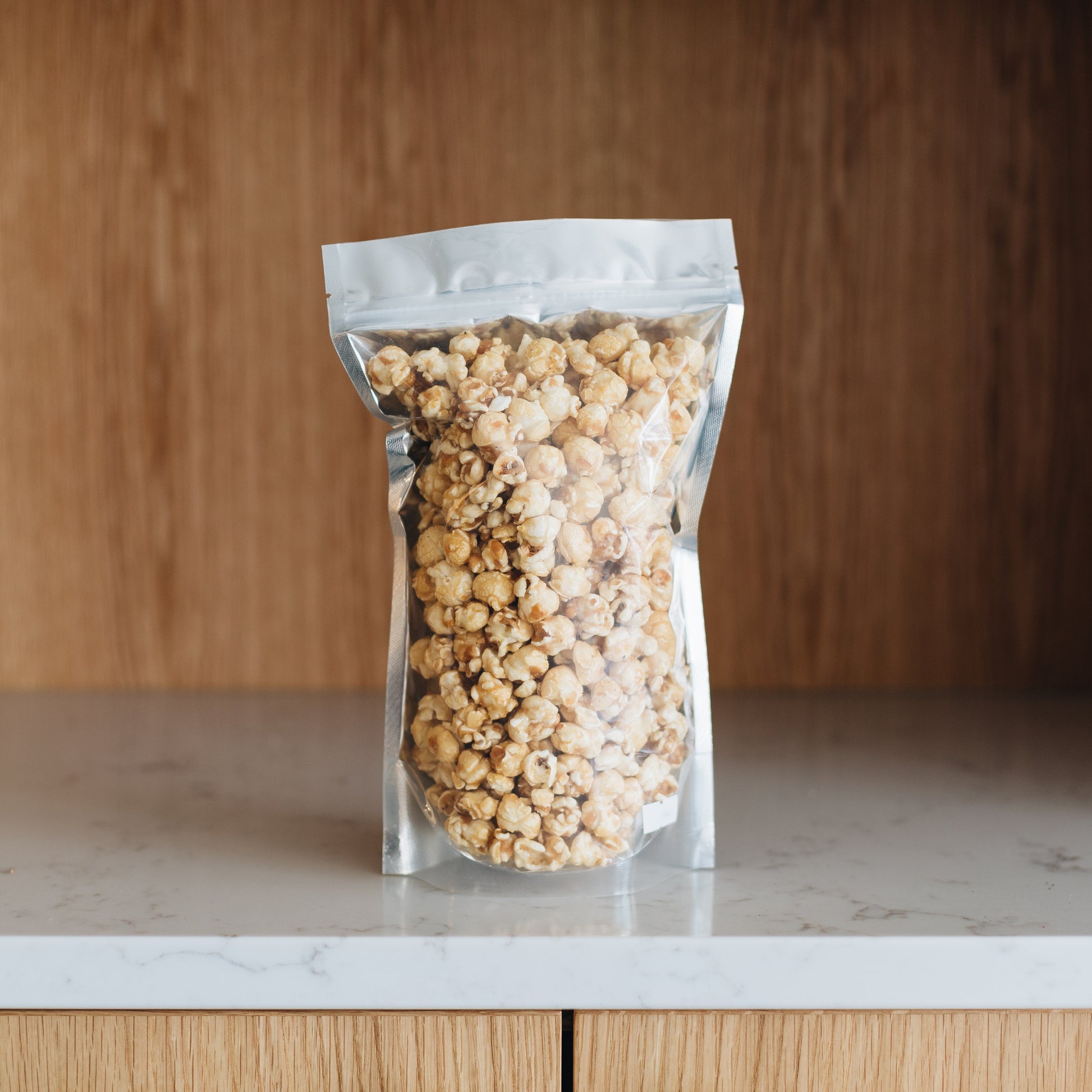 Sweet, Crunchy, and buttery caramel popcorn is the perfect snack to have around the house. Order it now online or stop in our shop to get a bag of this classic gourmet popcorn. Featured is our Large Caramel Popcorn (8oz)