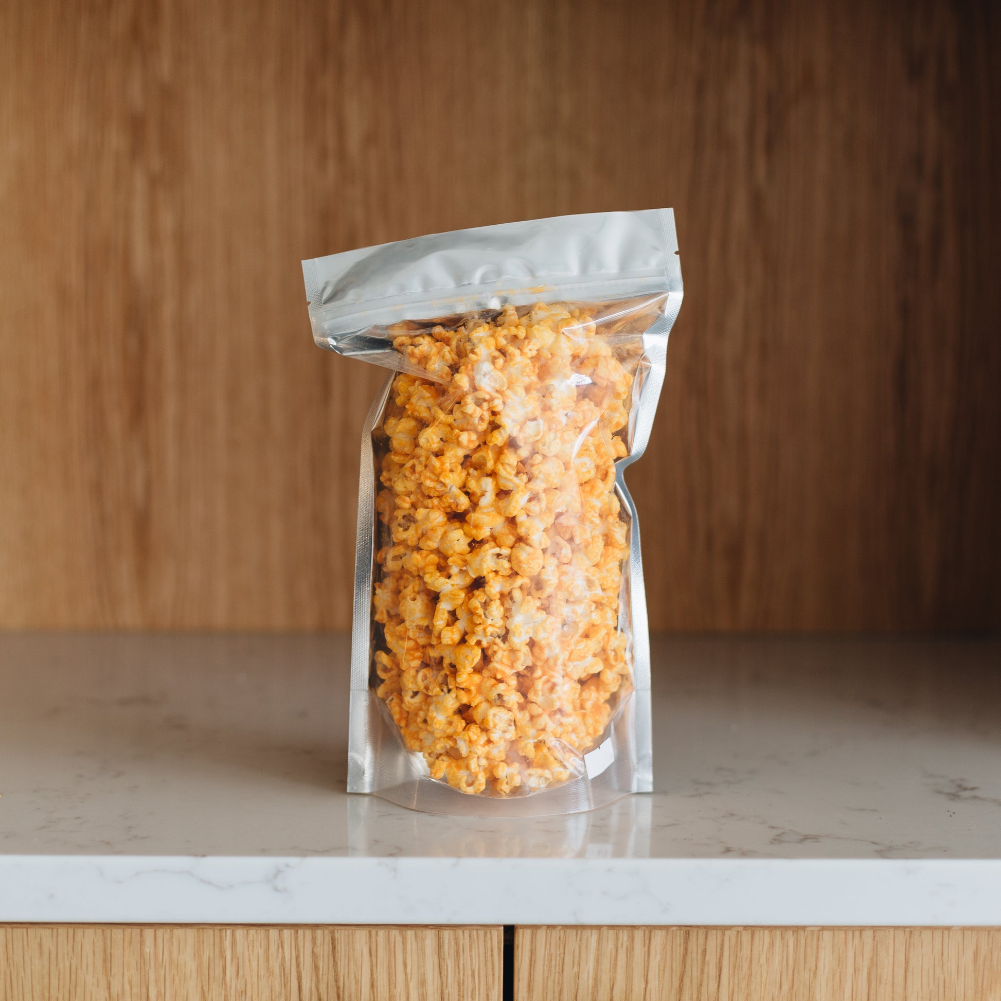 A true classic popcorn. Our Cheddar is creamy with a perfect crunchy popcorn. Get this wonderful tasting popcorn now. Order it online or stop in Popnotch Goods to get the best tasting cheddar popcorn. Featured is our Large Bag of Cheddar Popcorn (3.5oz)